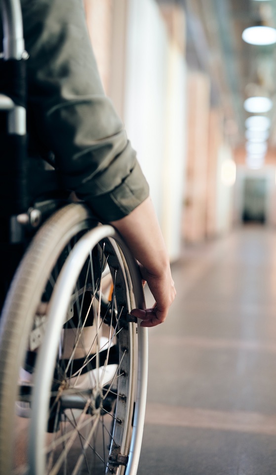 Person in Wheelchair in Hallway